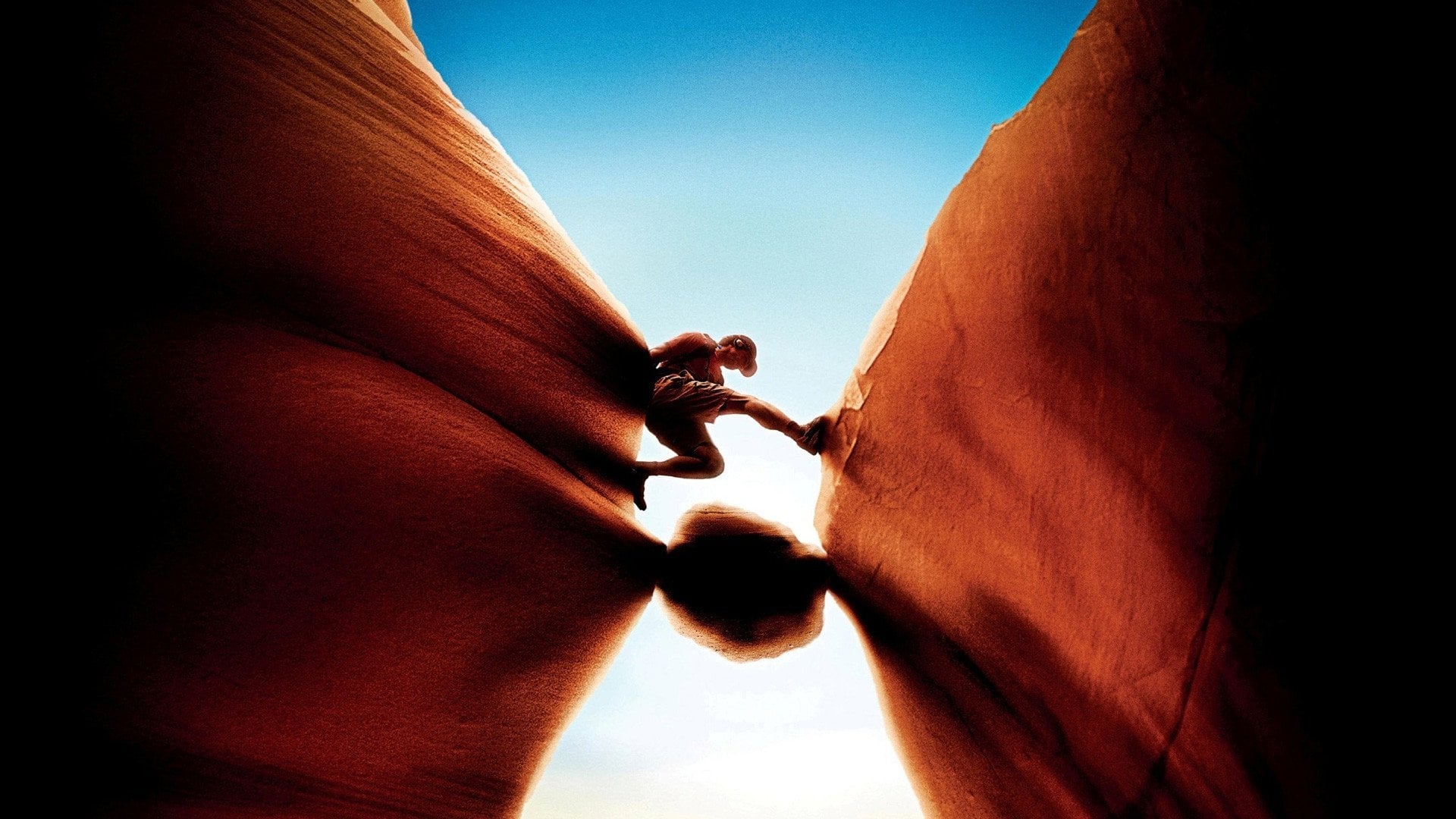 127 Hours' James Franco scales a crevasse in this promotional image.