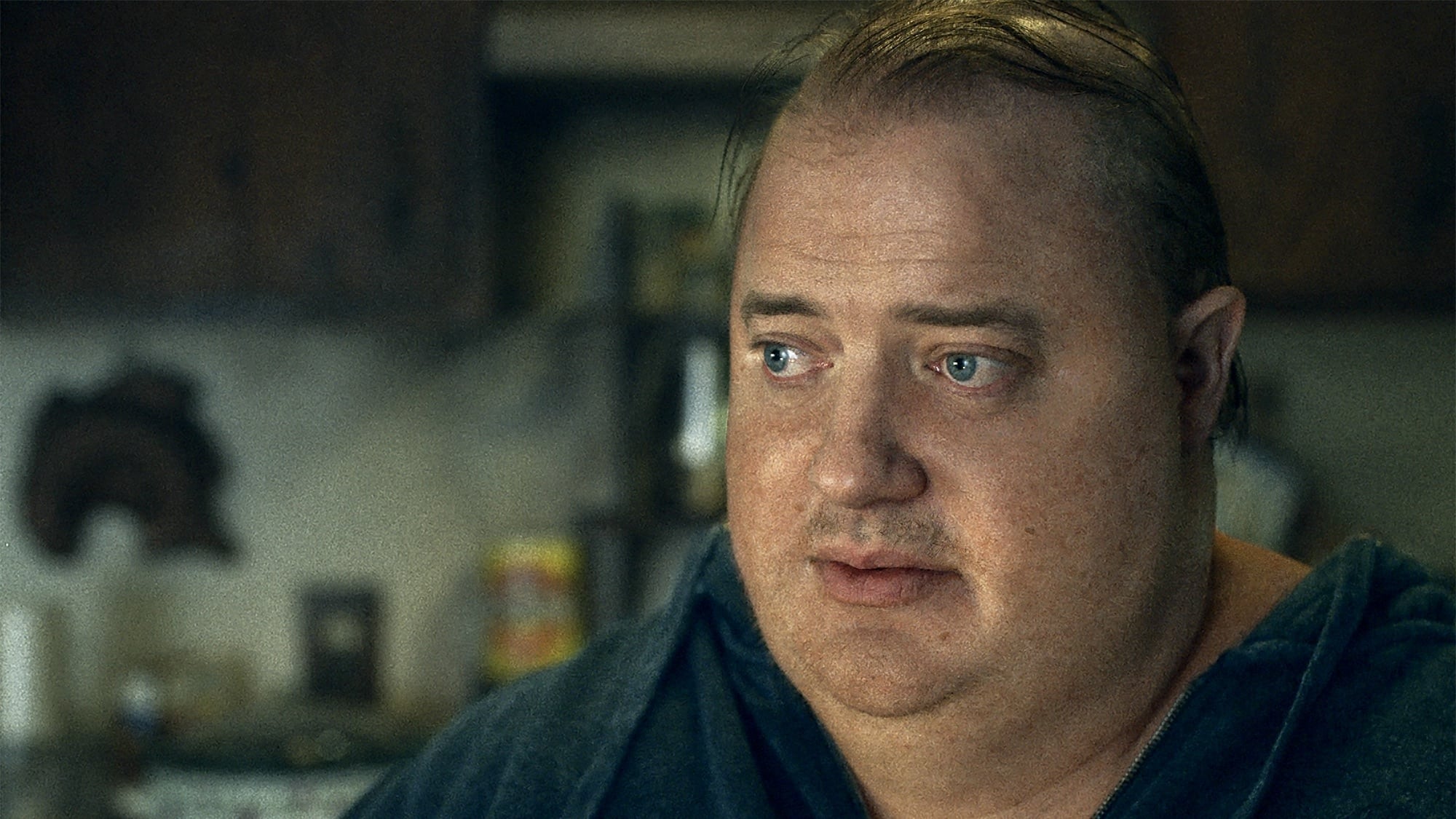 Brendan Fraser sports his Oscar-nominated prosthetics and makeup in this still from 2022's film, The Whale.